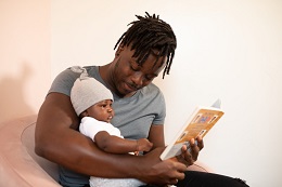 dad and infant reading