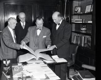 Mayor West looking at the City Cemetery Registration Book that was turned over to the TN Historical Society in 1955